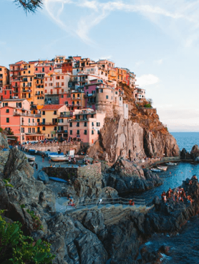 Colorful cliffside village by the sea.